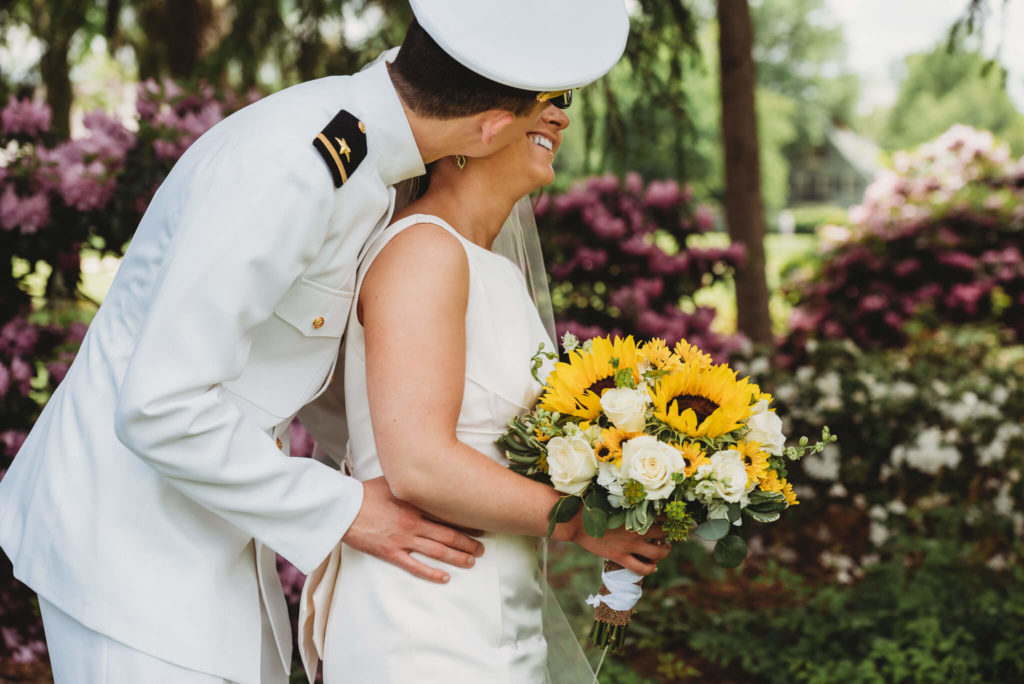 Groom kissing bride at their Portage Country Club Wedding