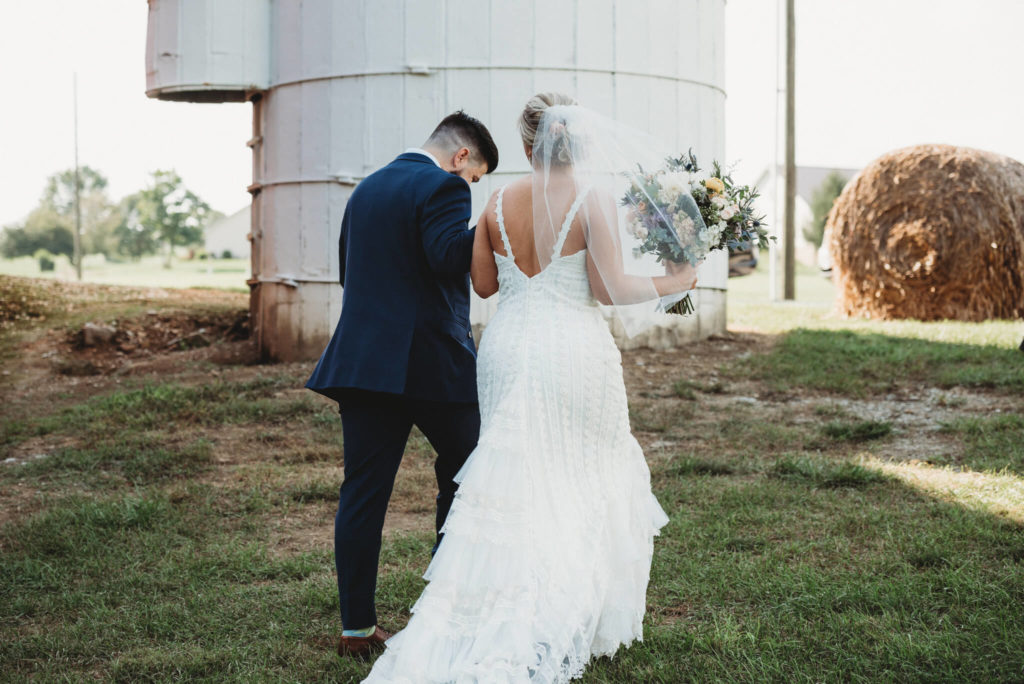 couple exiting wedding at century farms