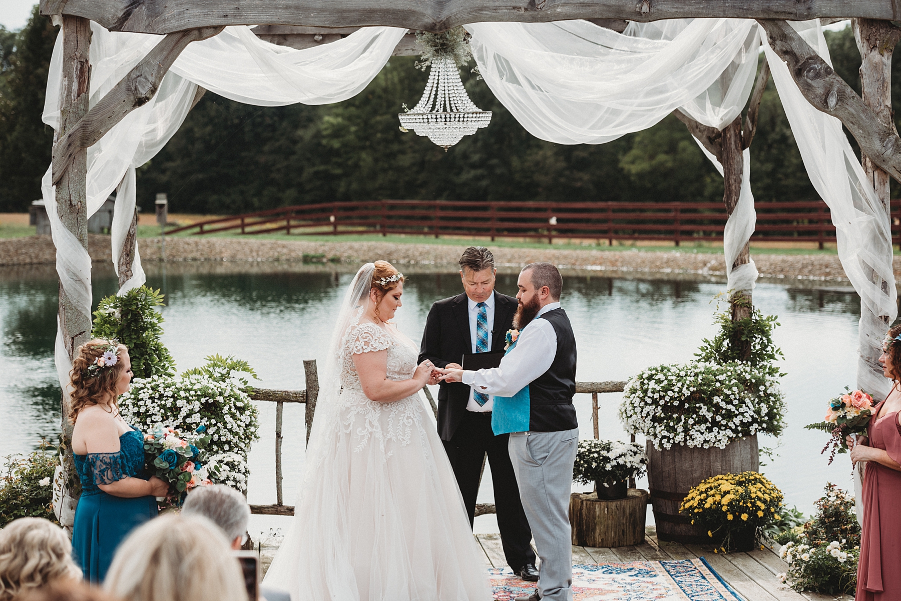 couple married near the pond at Peacock Ridge Wedding