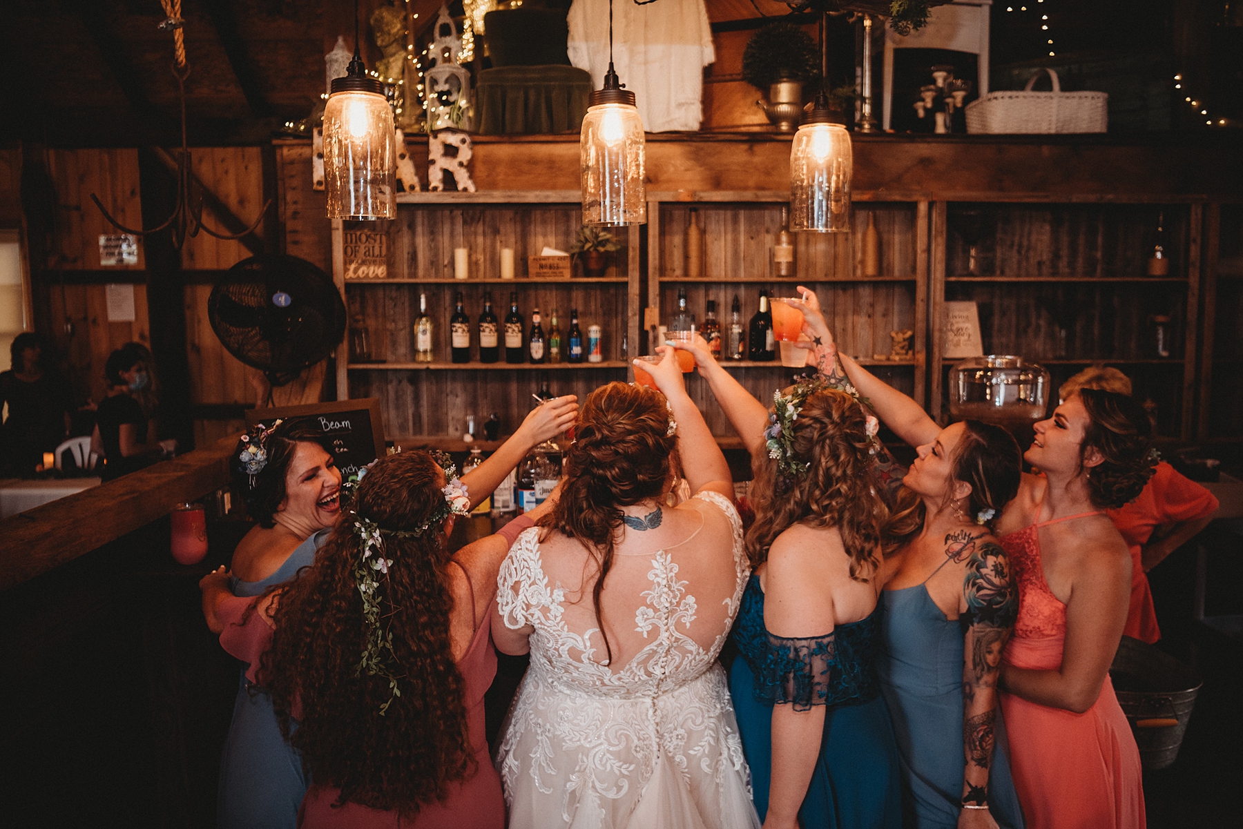 bride and wedding guests toast at their wedding reception