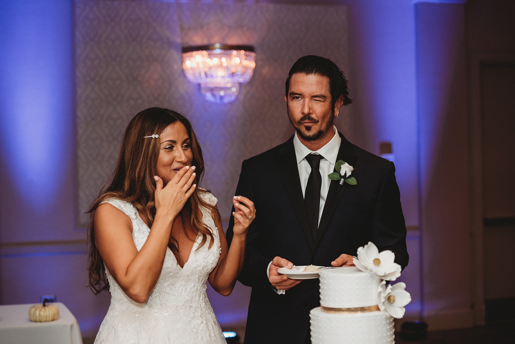 bride and groom cut their wedding cake at reception