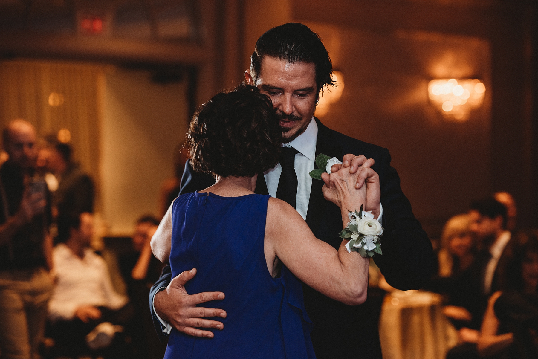groom dances with mother at wedding reception at Sheraton Suites Akron Cuyahoga Falls