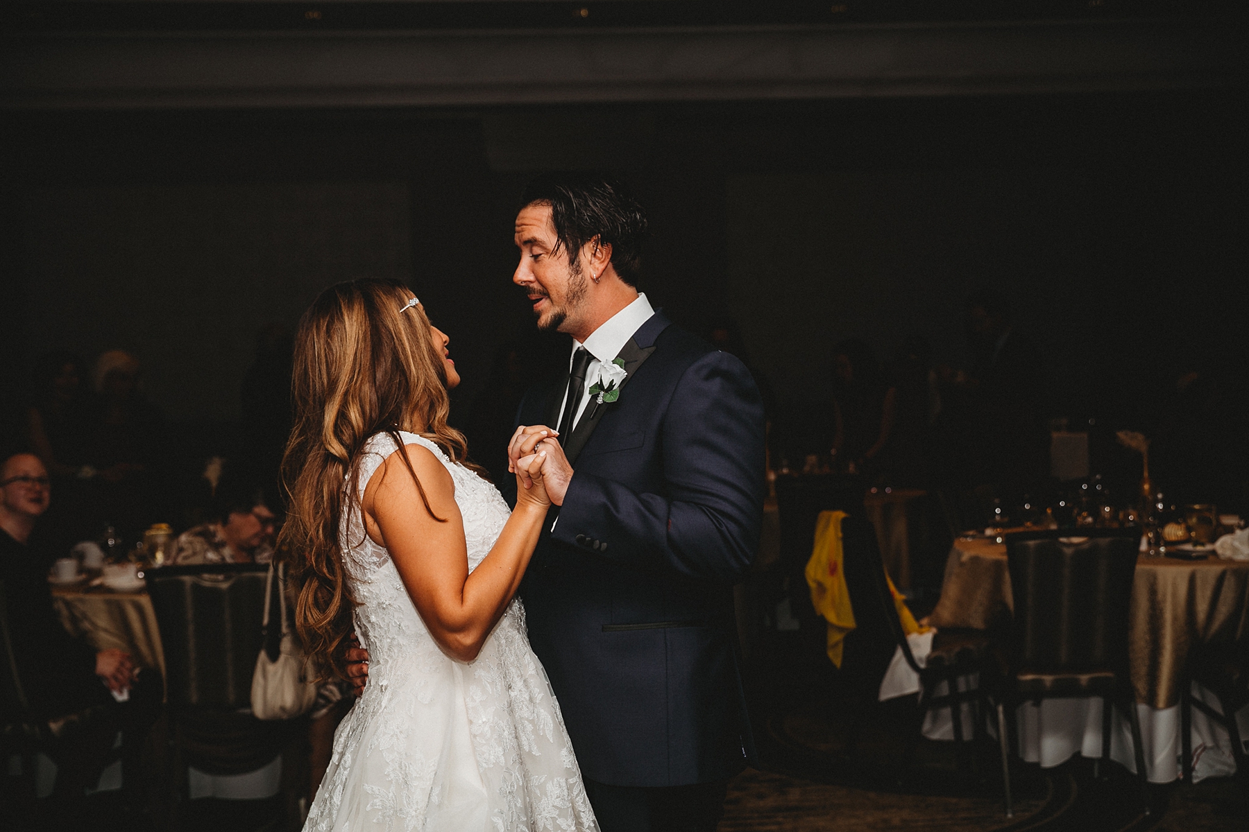 husband and wife share first dance at wedding reception