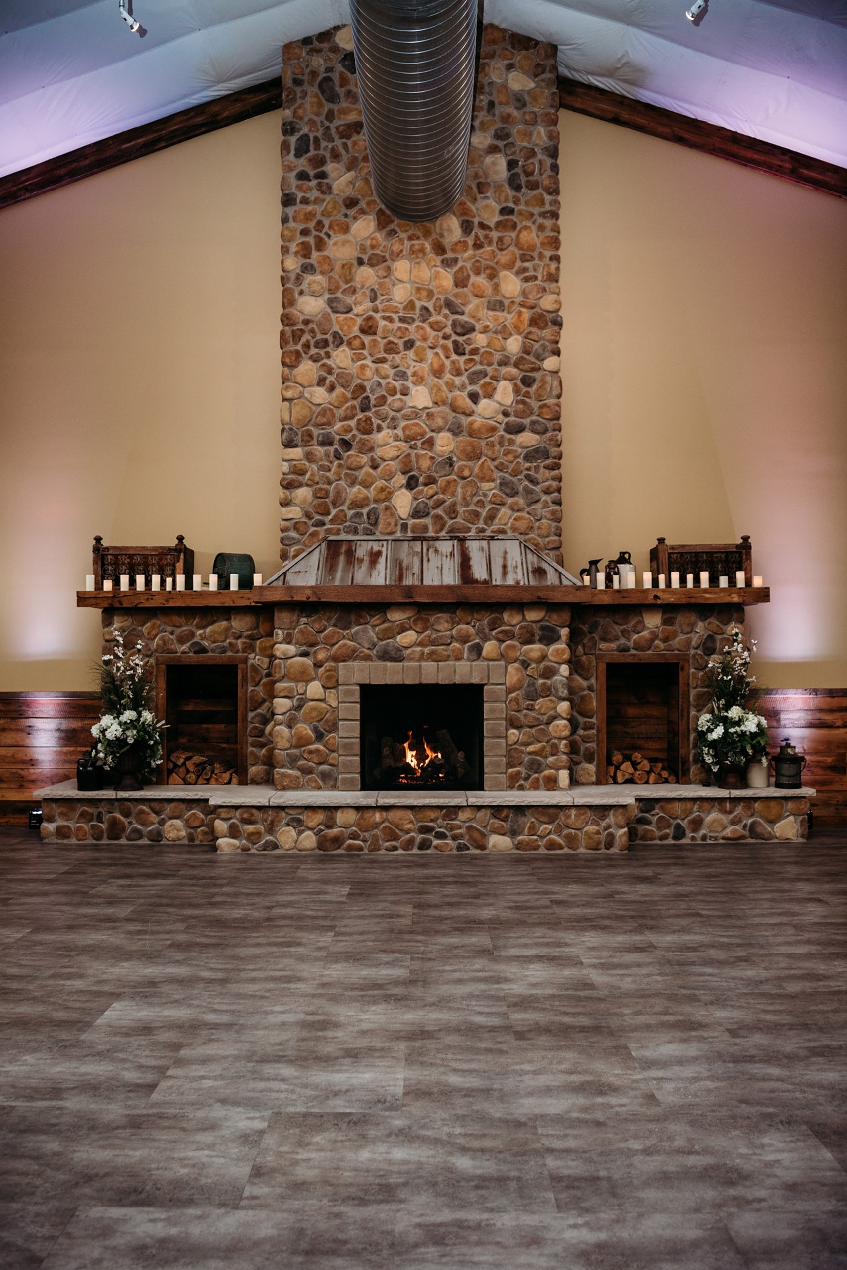 Inside Pine View Acres Barn featuring their stone fireplace